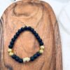 Matt onix, focilabda és arany Buddha ásvány karkötő